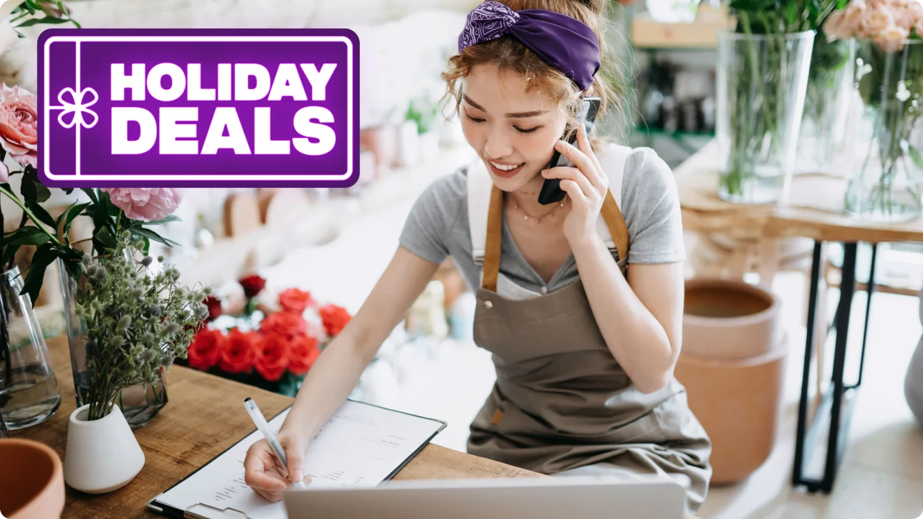 Co-owner holding a tablet.A roundel reads "Holiday Deals"