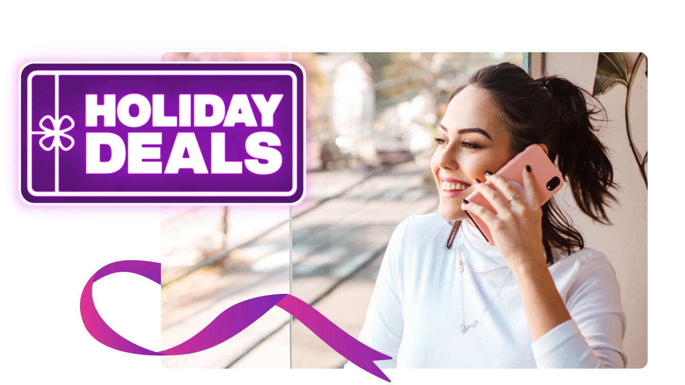 While having a conversation on the phone, a woman gazes out the window. A roundel reads "Holiday Deals"